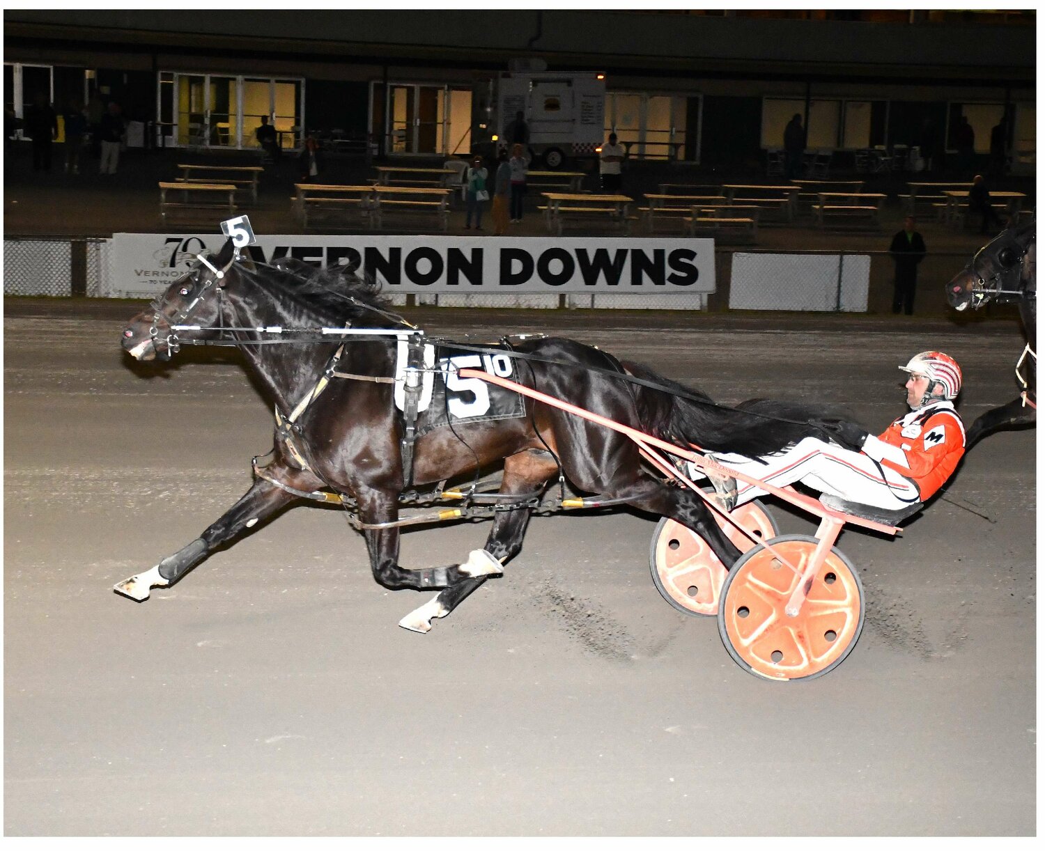 Natameri with driver John MacDonald exploded to win the featured $8,500 Open 1 Pace on Saturday night at Vernon Downs.