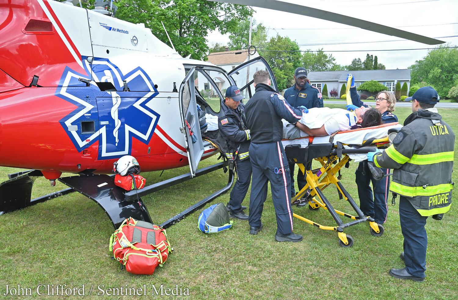 Students at Notre Dame Junior/Senior High School in Utica  had an up-close look at the potential tragic consequences of drunk driving  on May 17, 2023. A member of the Utica Fire Department and a LifeNet helicopter EMT wheel a gurney to the helicopter for transport.