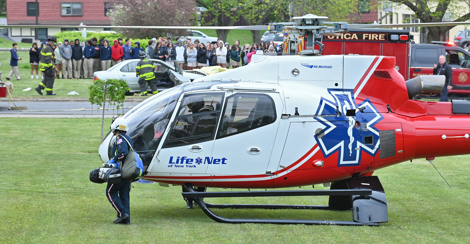 A LifeNet helicopter from Watertown lands at the campus of Notre Dame High School to transport a critically injured student during a mock DWI head on car crash. Students at Notre Dame Junior/Senior High School in Utica  had an up-close look at the potential tragic consequences of drunk driving  on May 17, 2023.