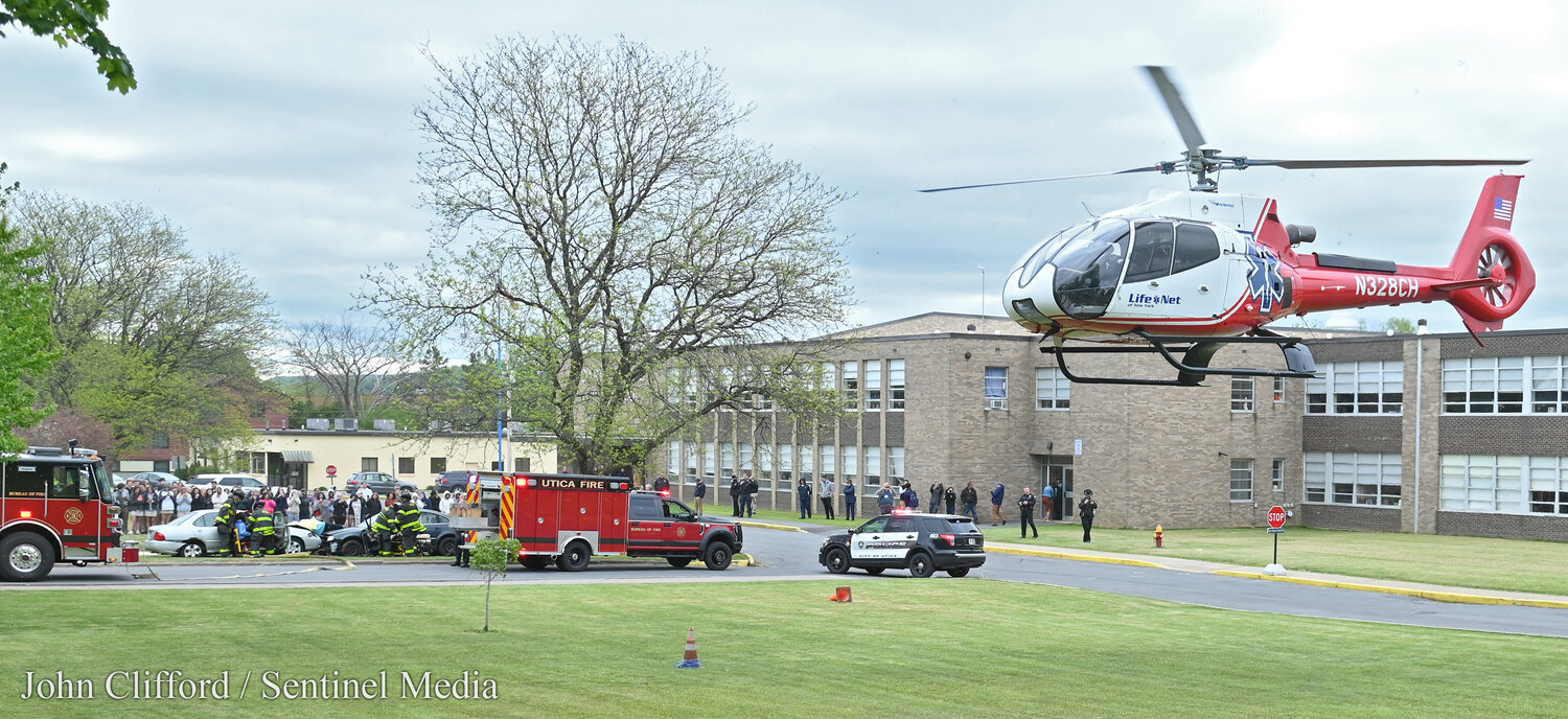 A LifeNet helicopter from Watertown lands at the campus of Notre Dame High School to transport a critically injured student during a Mock DWI exercise at Notre Dame Junior/Senior High School in Utica on May 17, 2023.
