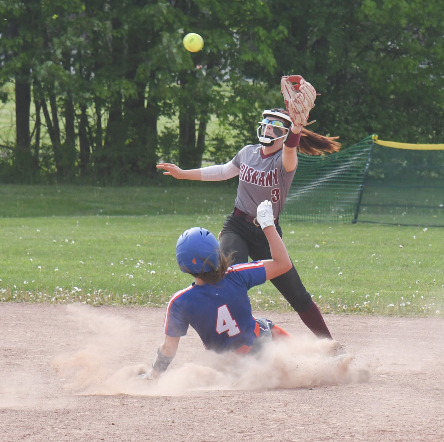 Oriskany's Brooke Matys waits for a throw as Poland's Madison Haver slides into second base on Friday in Oriskany. Haver was safe on the play.