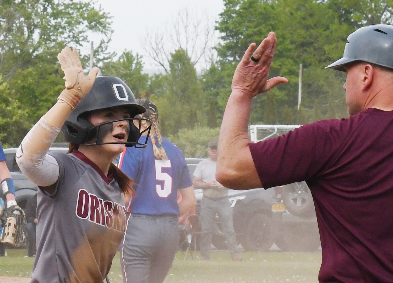 Brooke Matys celebrates with coach Mike Reilly on Friday in Oriskany's 3-2 win over Poland.