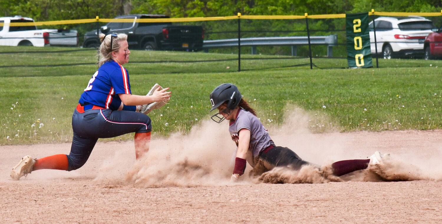 An Oriskany player slides in ahead of a throw at second base on Friday.