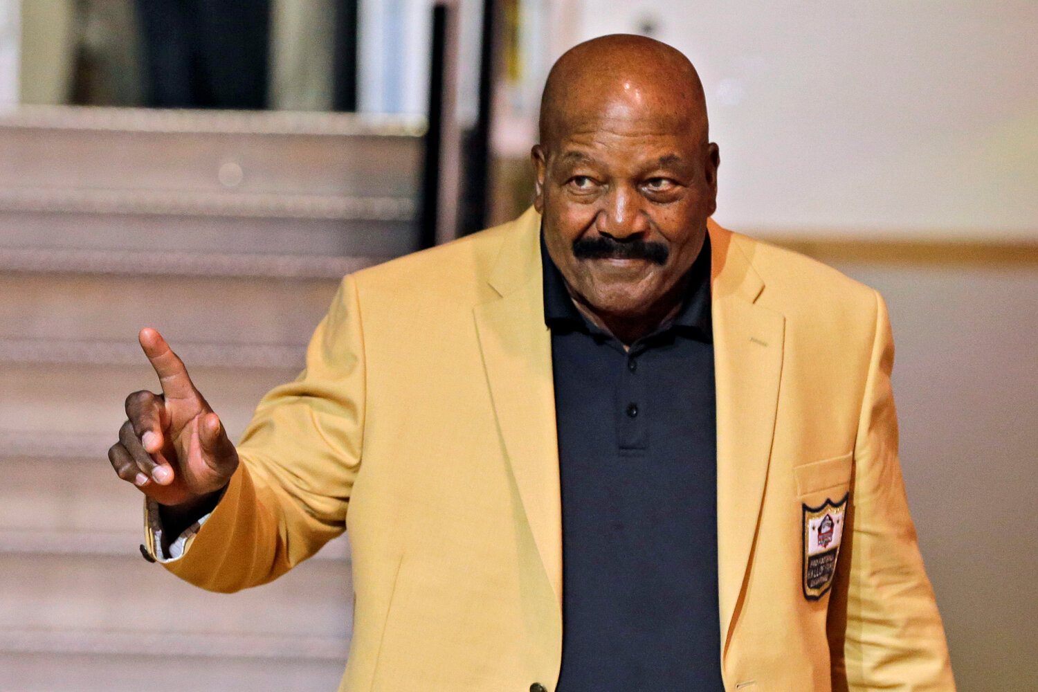 Jim Brown is introduced before the inaugural Pro Football Hall of Fame Fan Fest on May 2, 2014, in Cleveland. The NFL legend, actor and social activist died in his Los Angeles home on Thursday night, with his wife, Monique, by his side, according to a spokeswoman for Brown’s family. He was 87.