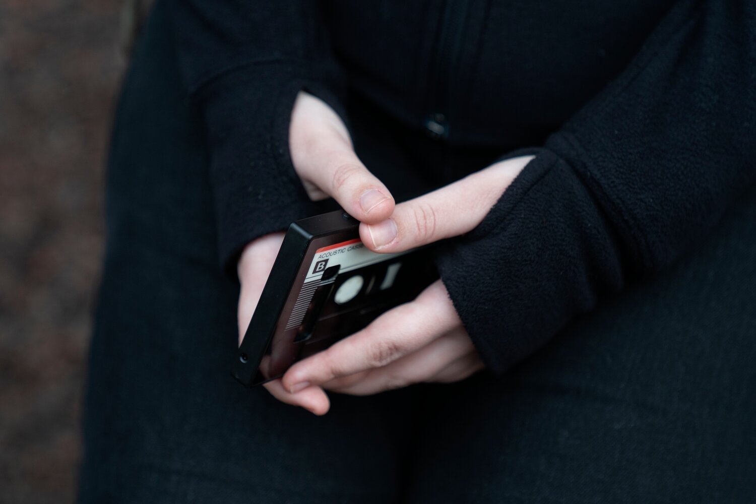 A teenager holds her phone as she sits for a portrait near her home in Illinois, on Friday, March 24, 2023. The U.S. Surgeon General is warning there is not enough evidence to show that social media is safe for young people — and is calling on tech companies, parents and caregivers to take "immediate action to protect kids now."