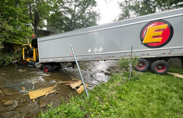The driver was hospitalized after he lost control of his tractor trailer on Red Hill Road in New Hartford around noon on Wednesday, according to the New Hartford Police Department. The truck then crashed across the Sauquoit Creek.