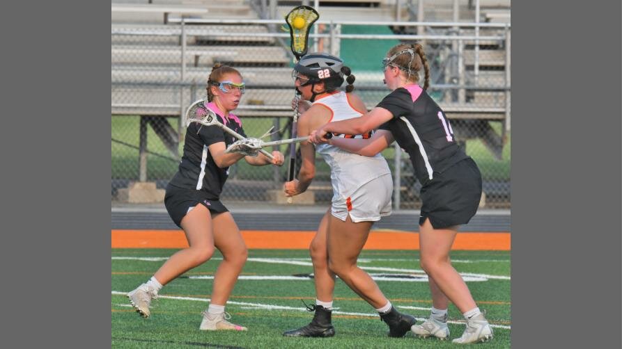 Drew Kopek of Rome Free Academy fights through traffic as Syracuse's Shannon Smith, left, and Abigail Delaney in the first half Tuesday night at RFA Stadium. Kopek scored four times in the Black Knights' 12-2 win in the quarterfinals of the Section III Class A postseason.