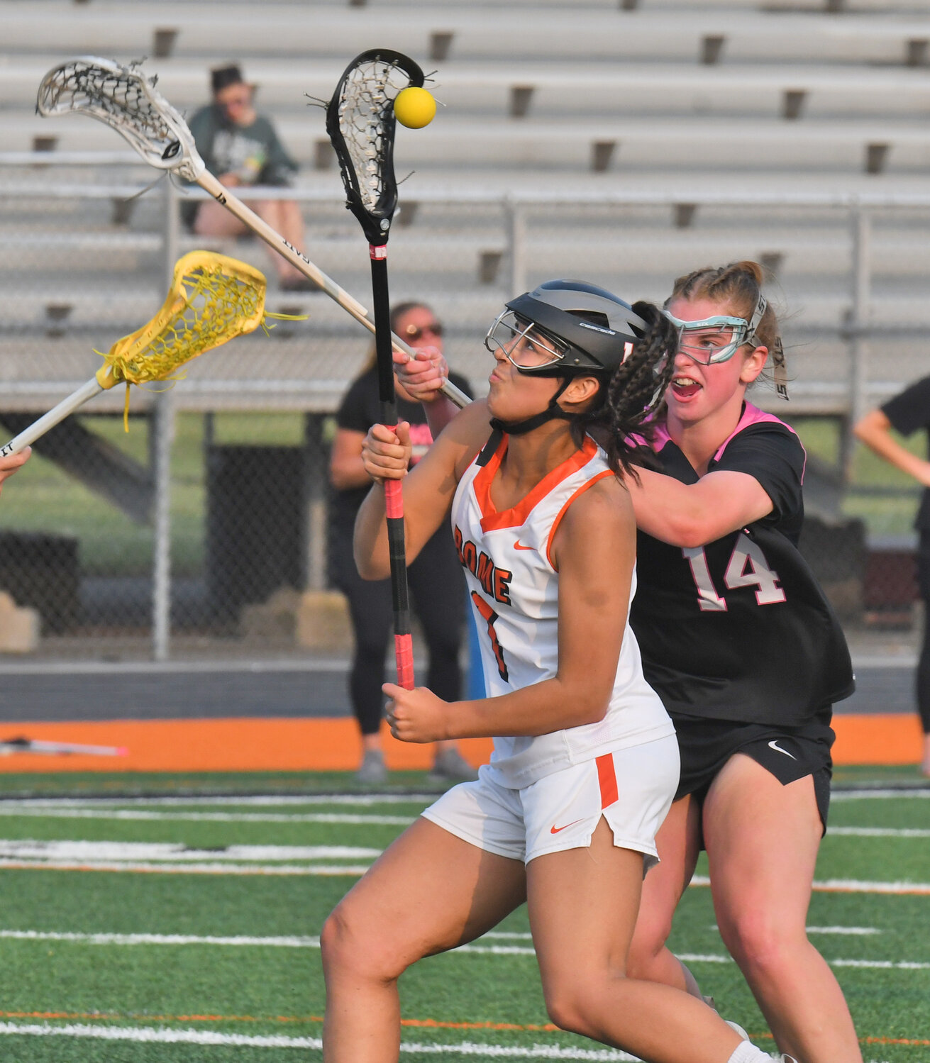 Danielle D'Aiuto of Rome Free Academy tries to maintain possession as she's defended by Syracuse's Abigail Delaney Tuesday night. D'Aiuto scored and the Black Knights won 12-2 at RFA Stadium in the quarterfinals of the Section III Class A postseason.