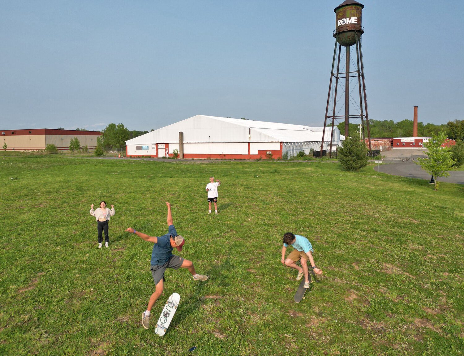 The planned skatepark in Rome to memorialize Stone Mercurio would sit in part of this vacant, city-owned parcel between Harbor Way and Mill Street. The city’s navigation center for the Erie Canal borders another side. From left: Stone’s sister Carmella, and his friends Hayden McMonagle, Mikey Futia and Brandon Gannon.