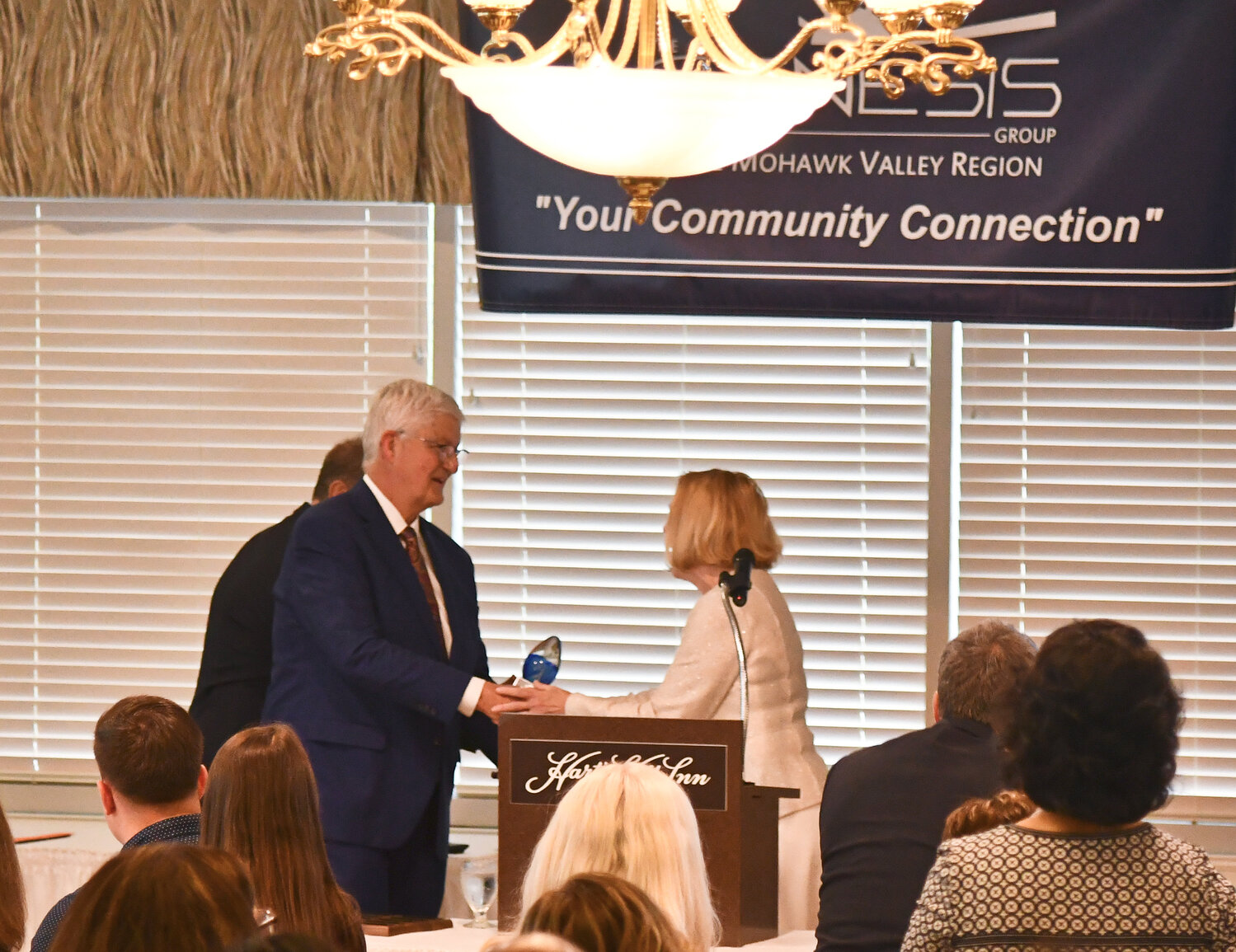 Robert C. Scholefield, MS, RN and executive vice president of facilities and real estate for MVHS, accepts the Genesis Group’s 2023 Lifetime Achievement Award from Darlene Stromstad, MVHS President and CEO, on May 24 at the Hart’s Hill Inn.