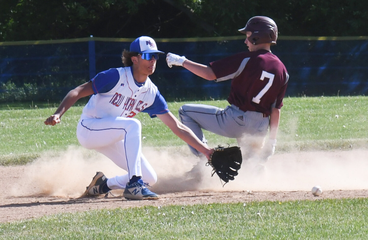 Oriskany's Anthony Kernan (7) slides in safely ahead of a throw to New York Mills' Frank Calhoun Thursday in the Section III Class D quarterfinal game. Kernan had a pair of runs batted in during the team's 10-3 win.