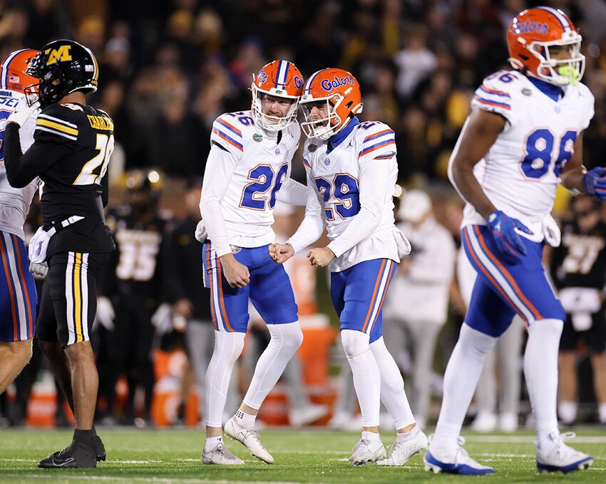 Trey Smack and Jeremy Crawshaw smiled after Smack made one field goal and four extra-point attempts against Missouri on November 18.