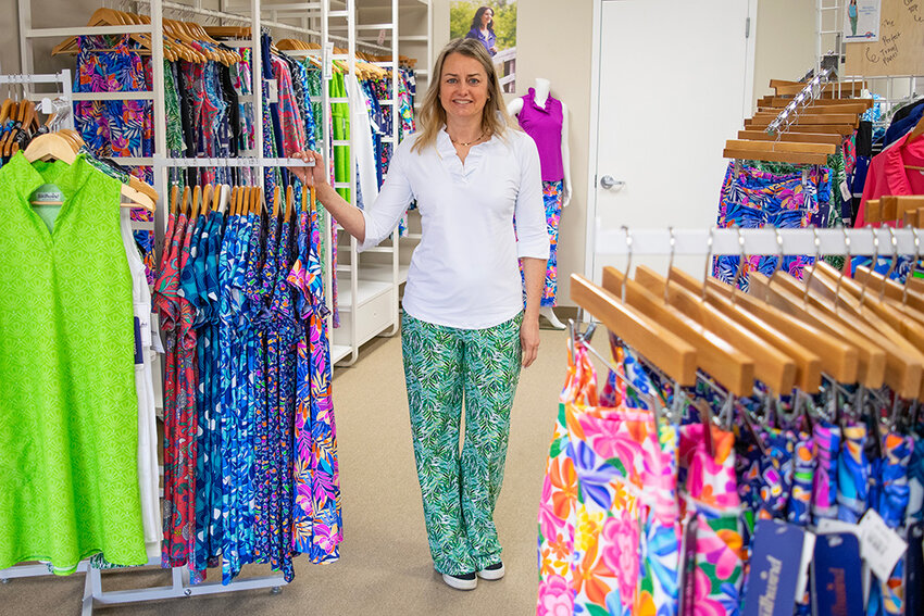 Severna Park resident Christine Maly, pictured wearing her product, is the owner and CEO of USA-made athletic women’s clothing brands Spunkwear and Southwind Apparel, which are headquartered on Kent Island.