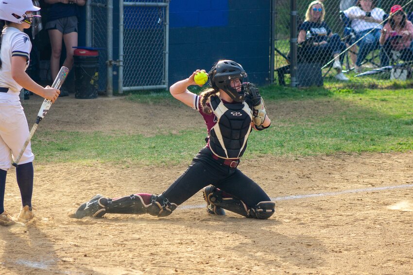 Broadneck's Abby Favazza steadied herself to throw out a runner at second base.