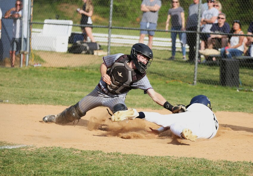 Severna Park’s Jackson O’Brien slid into home plate ahead of a tag during his team’s 10-2 win over Broadneck on Monday.