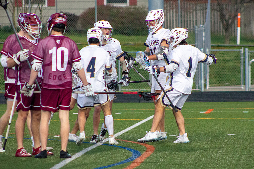 Severna Park celebrated one of 11 goals against Broadneck during a Falcons’ win on April 12.