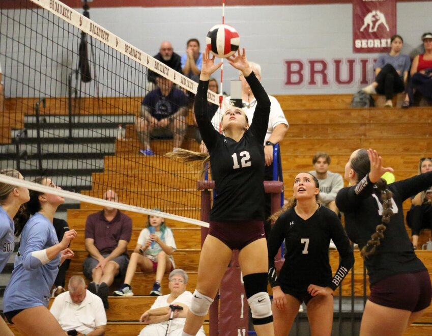 Barrett Bolter (12) set the ball during Broadneck's home match with South River on September 19. Bolter and Sydney Lawrence have tag-teamed the setter position to facilitate the Bruins' attack.