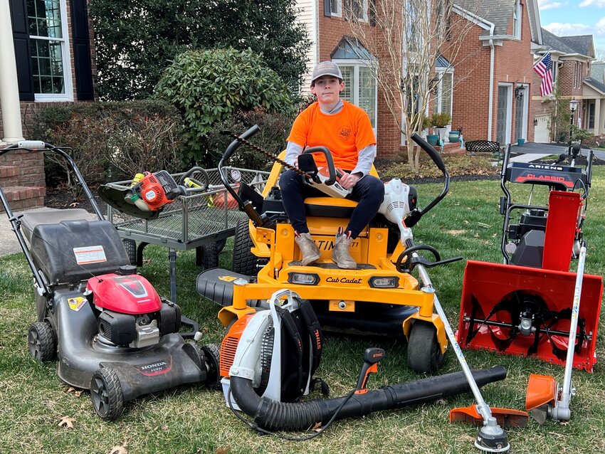 Carson Viskocil, an eighth-grader at Severna Park Middle School, sat in his riding lawnmower surrounded by the equipment that he uses for his landscaping business.