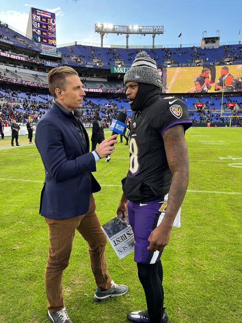 CBS sideline reporter and Severn School graduate Evan Washburn (left) interviewed Ravens quarterback Lamar Jackson after a 2023 regular season game.