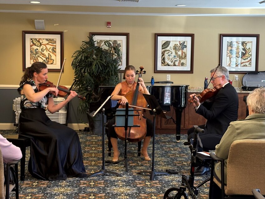 Renowned cellist Alicia Ward (center) performed at Brightview Severna Park in March with Andréa Picard Boecker (left) and Christian Tremblay (right).