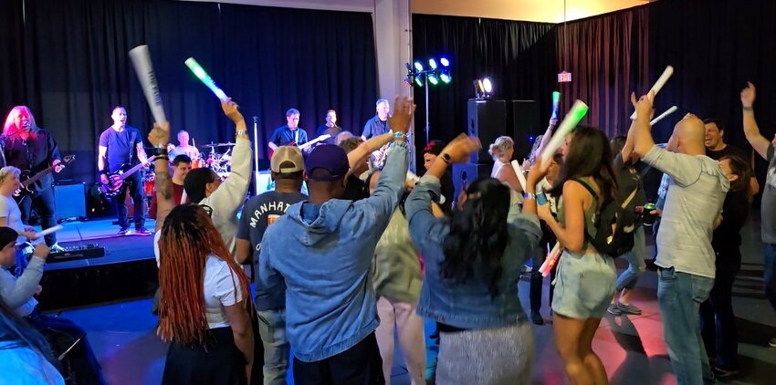 Attendees danced to music performed by a live band at opening night of THE FUSE, a new inclusive nightclub experience hosted by Millersville-based nonprofit OBI.
