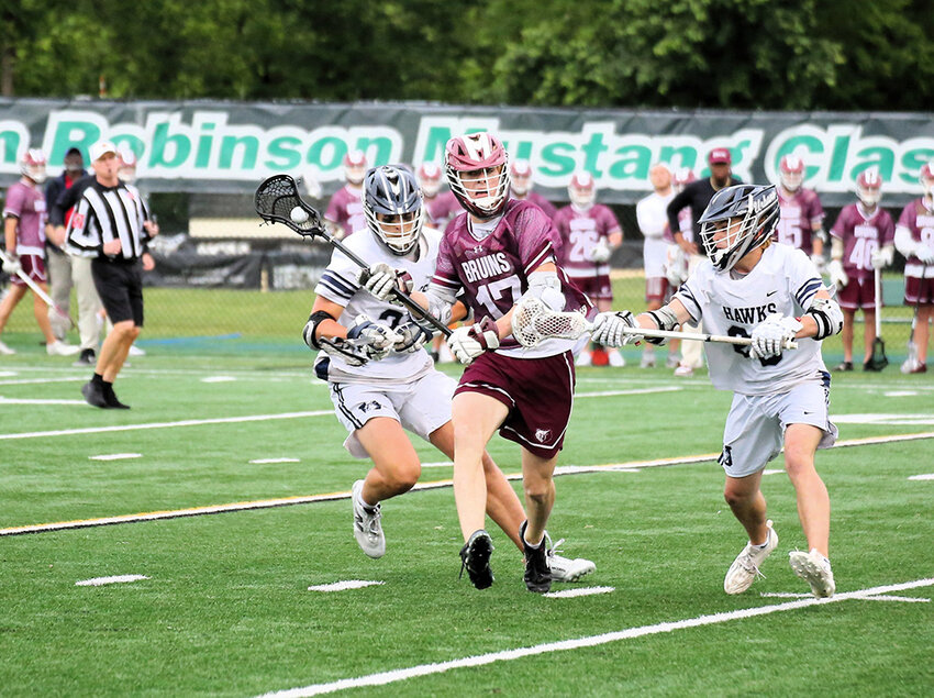 Jack Deitch (17) battled for possession with Urbana’s midfield throughout the game.