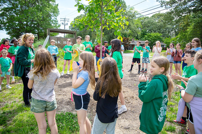 Oak Hill Elementary School Principal Deneen Houghton read a poem and cut a ceremonial ribbon during a ceremony on May 20.