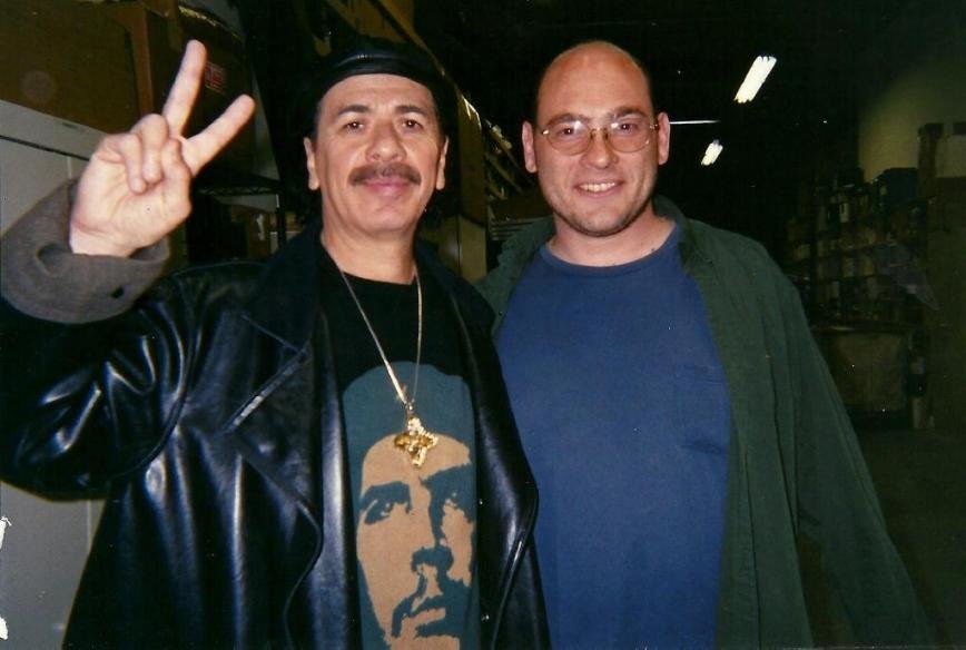 Former Severna Park resident turned filmmaker Erik Crown (right) interviewed several music legends, including Carlos Santana, while filming the documentary “Livicated.”
