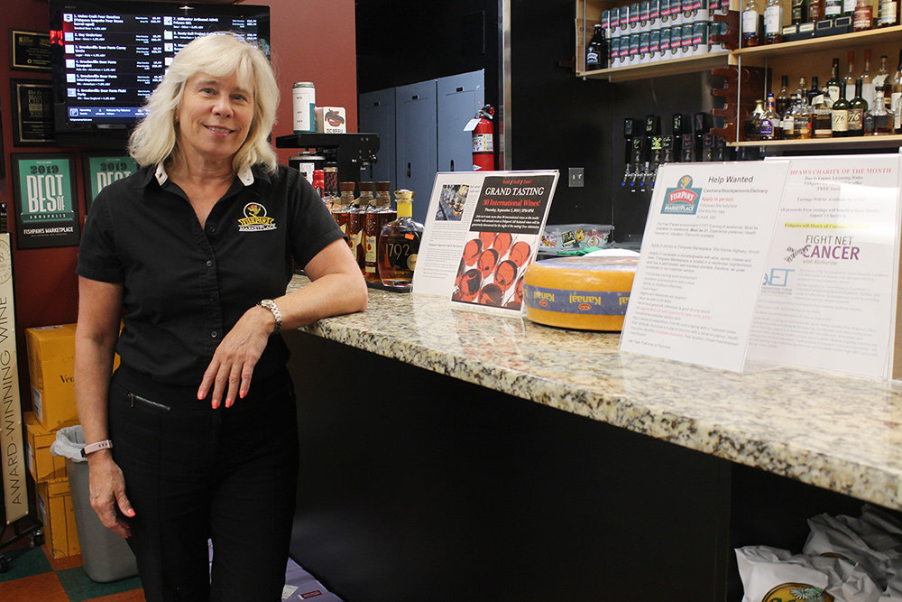 Fishpaws Marketplace owner Kim Lawson is one of 18 liquor store owners opposing a new store that could be coming to the Robinson Crossing shopping center.