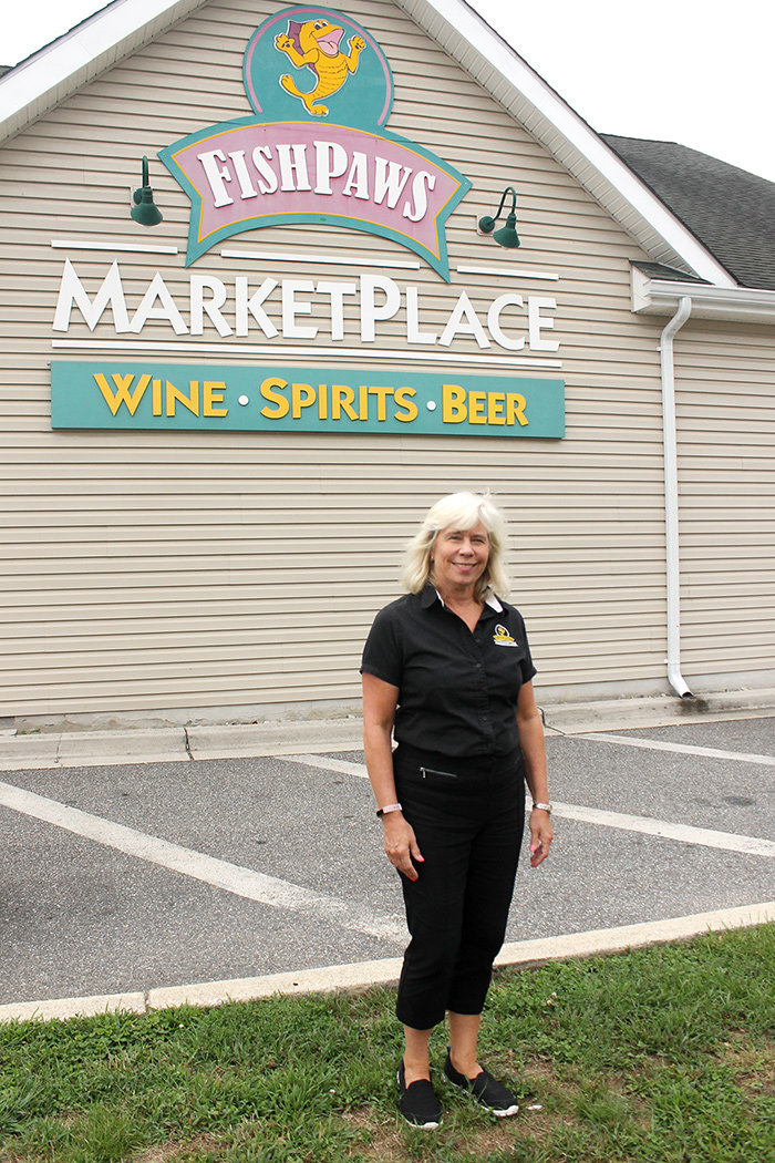 While Kim Lawson’s customers depend on Fishpaws for its selection of wine, beer and spirits, they also come for gourmet cheeses, fresh-baked baguettes and fun events.