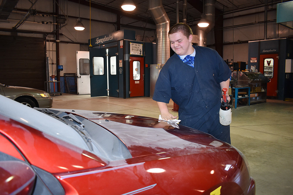 Antony Barnes demonstrated how to properly prepare a car to be refinished.