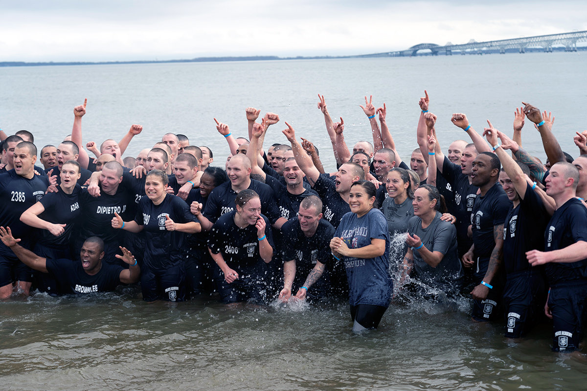 Cadets and instructors from the 90th Police Academy gathered after the plunge at Sandy Point State Park.