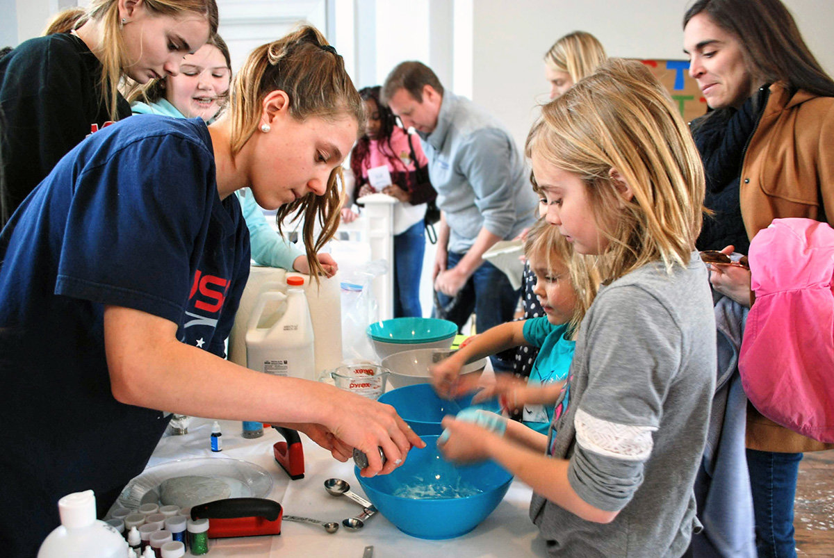Amelia Goger, Maddy Sullivan and Bess Carr (front to back) of Severna Park Middle School taught Kennedy and Ali Otto to make slime.