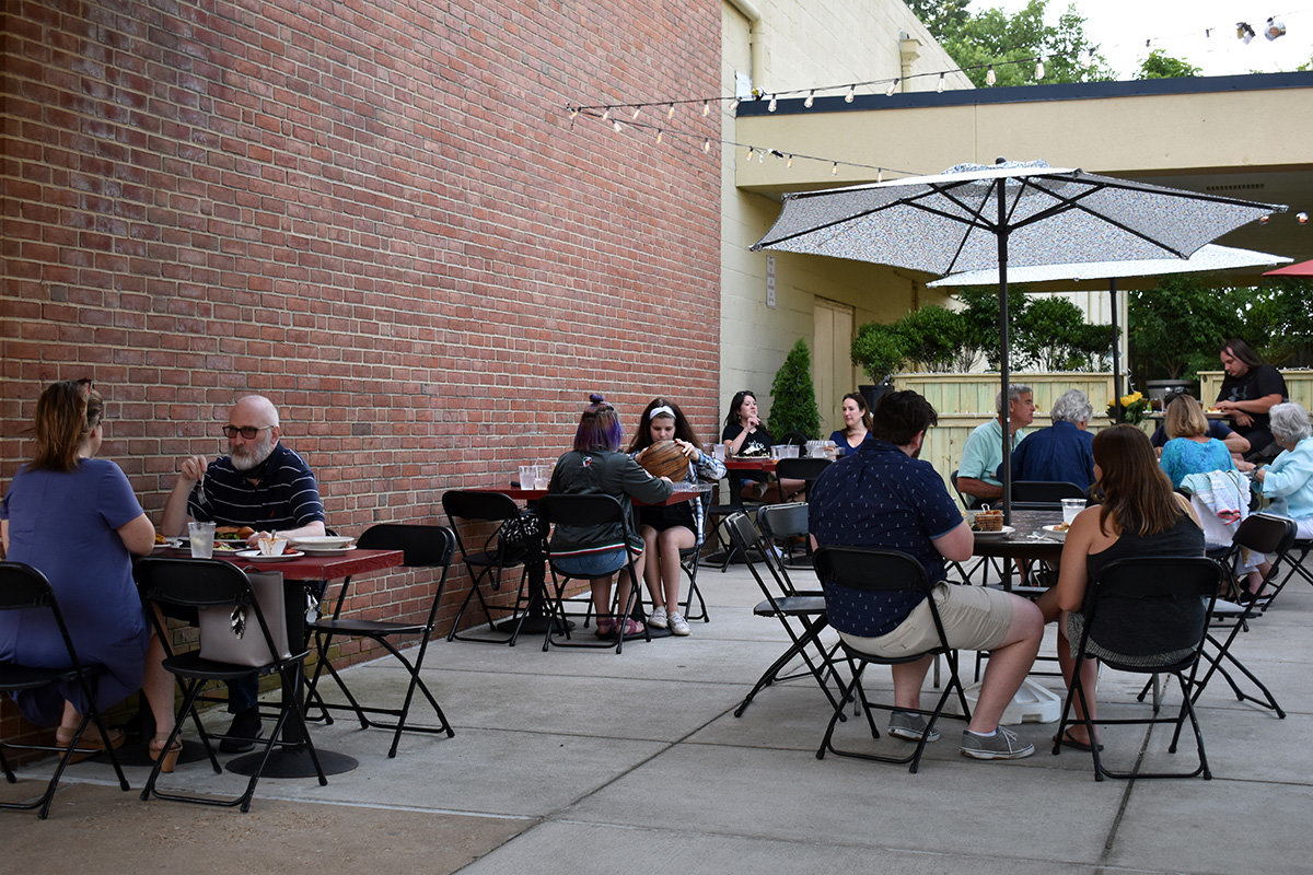 The outdoor dining room at Garry’s Grill is equipped with a bar, yard games and furniture rented from Absolute Party Rentals in Millersville.