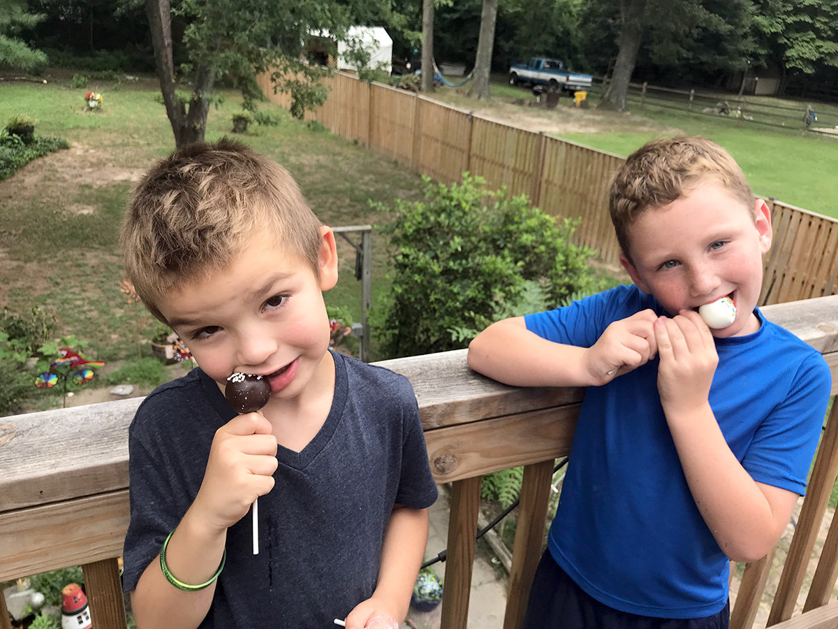 Josiah (left) enjoyed a gluten-free cake pop while Liam chomped into a confetti pop.