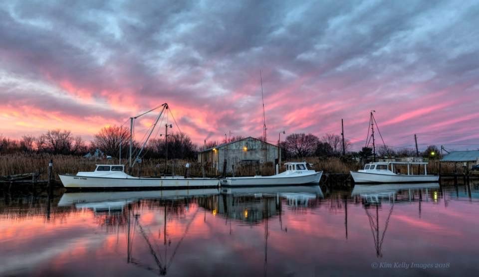 Kim Kelly likes capturing images that depict the Chesapeake Bay. This photo is called “Workboats at Dawn”
