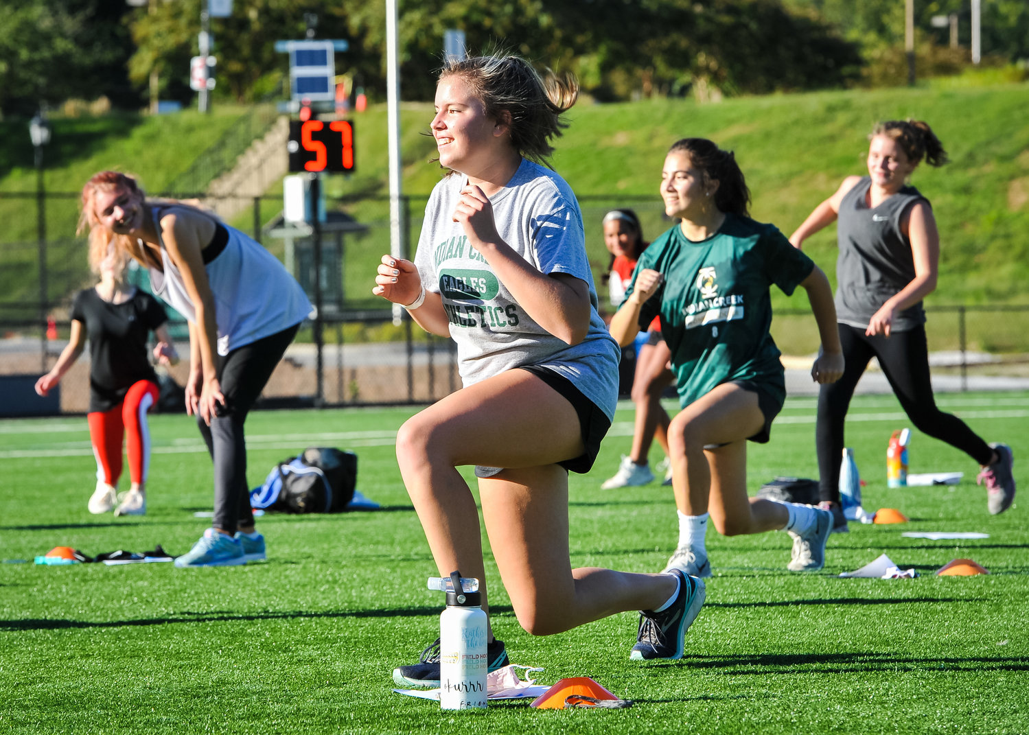 Abby Bach (center) engaged in training sessions.