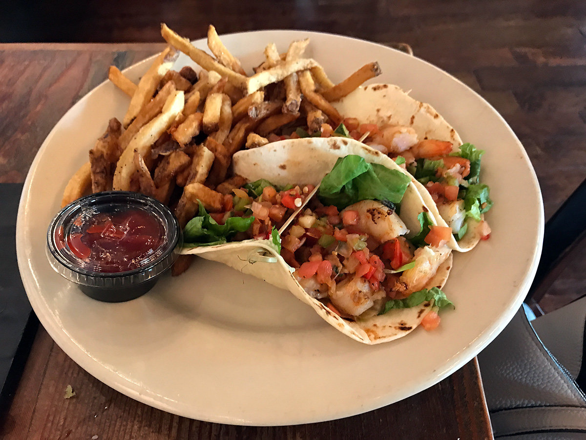 Filled with shrimp, avocado-infused sour cream and "Chesapeake salsa" — tomato, cucumber, chili peppers, cilantro and shaved lettuce — the “broken” shrimp tacos are a hit.