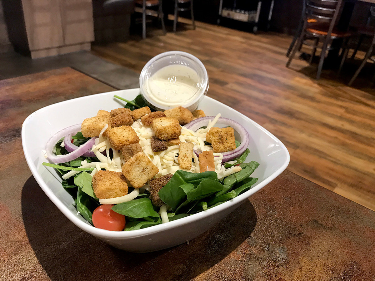 Looking for a healthy dish? Ledo Pizza serves a generous portion of spinach salad.