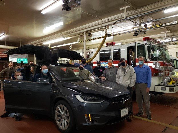 Firefighters examined a Tesla Model X, from Tesla of Baltimore, during a workshop on electric vehicle fires at Earleigh Heights Volunteer Fire Company.