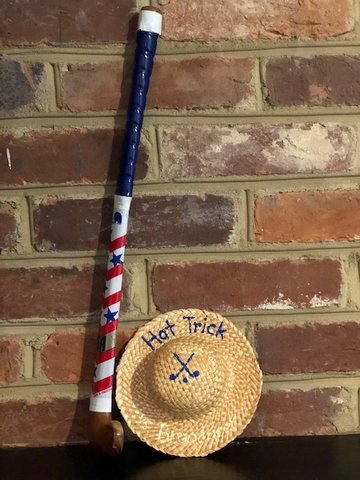 This is one of Kristen Burke's hat tricks and mini field hockey sticks given from Coach Shelton at an end-of-year banquet. Shelton wanted Kristen to work on getting her 6-foot-3 frame low.