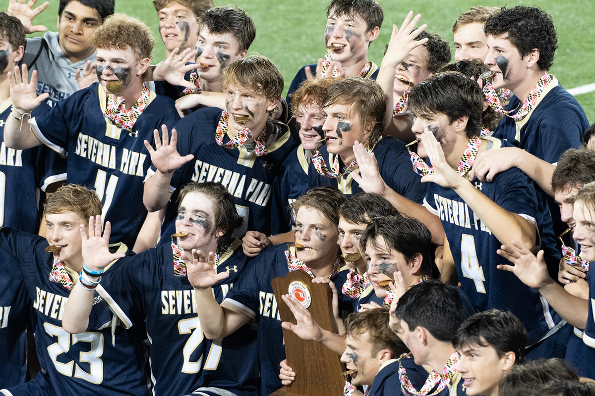 Severna Park players displayed five fingers to count the number of consecutive championships won by the Falcons.