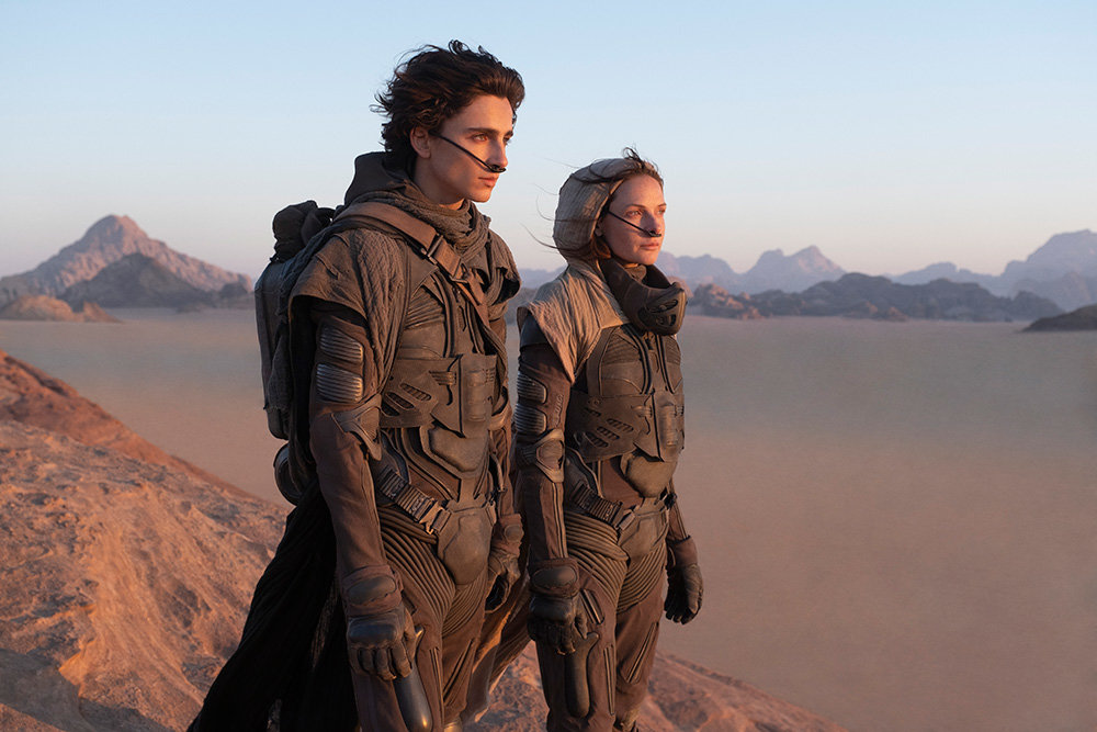 In “Dune,” Timothée Chalamet (left) portrays Paul Atreides and Rebecca Ferguson plays Jessica Atreides.