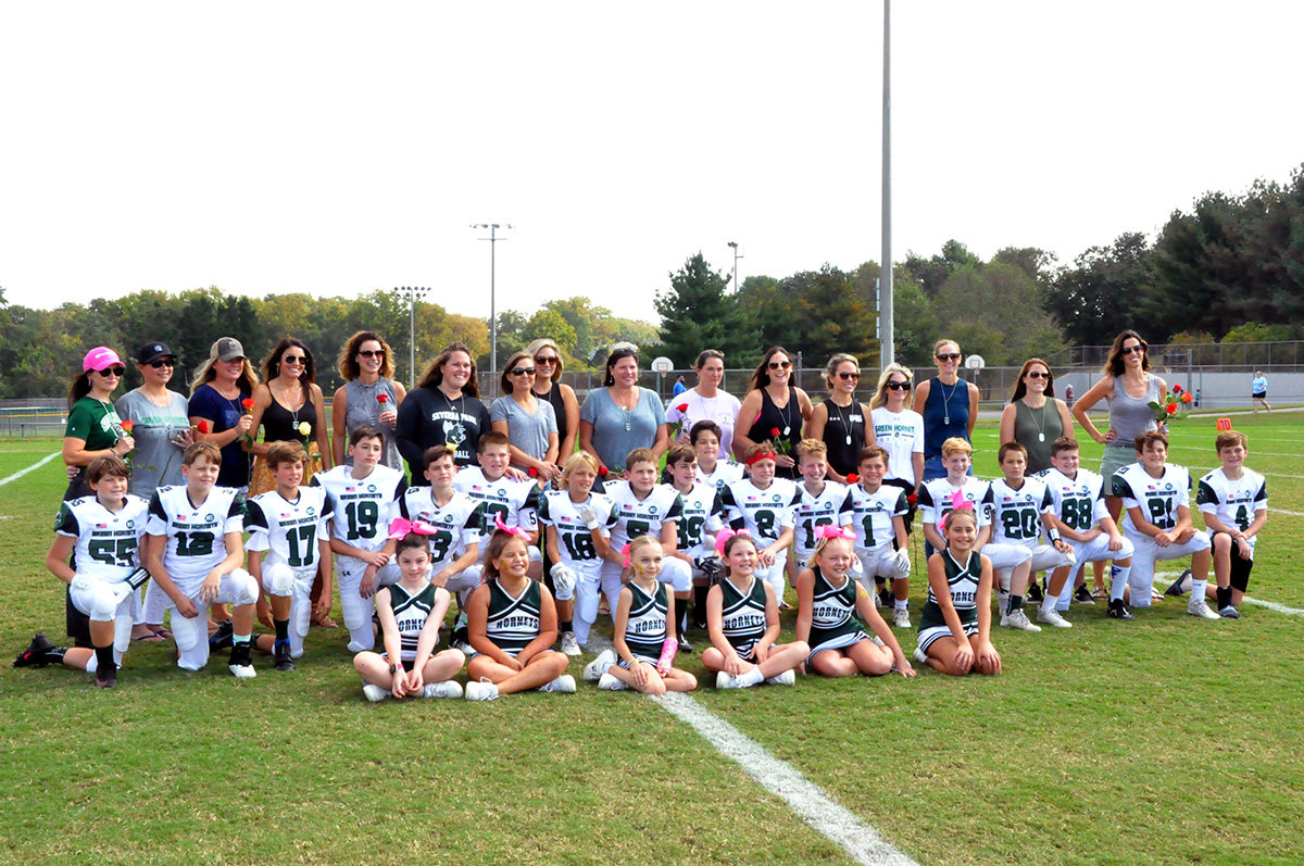 Members of the 11U A team posed for pictures with their families before their homecoming game on October 16.