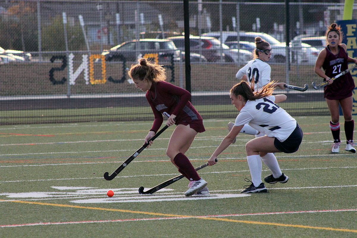 Broadneck's Jess Kopernick advanced the ball as Noel Stefancik, No. 21 for the Falcons, defended against her.