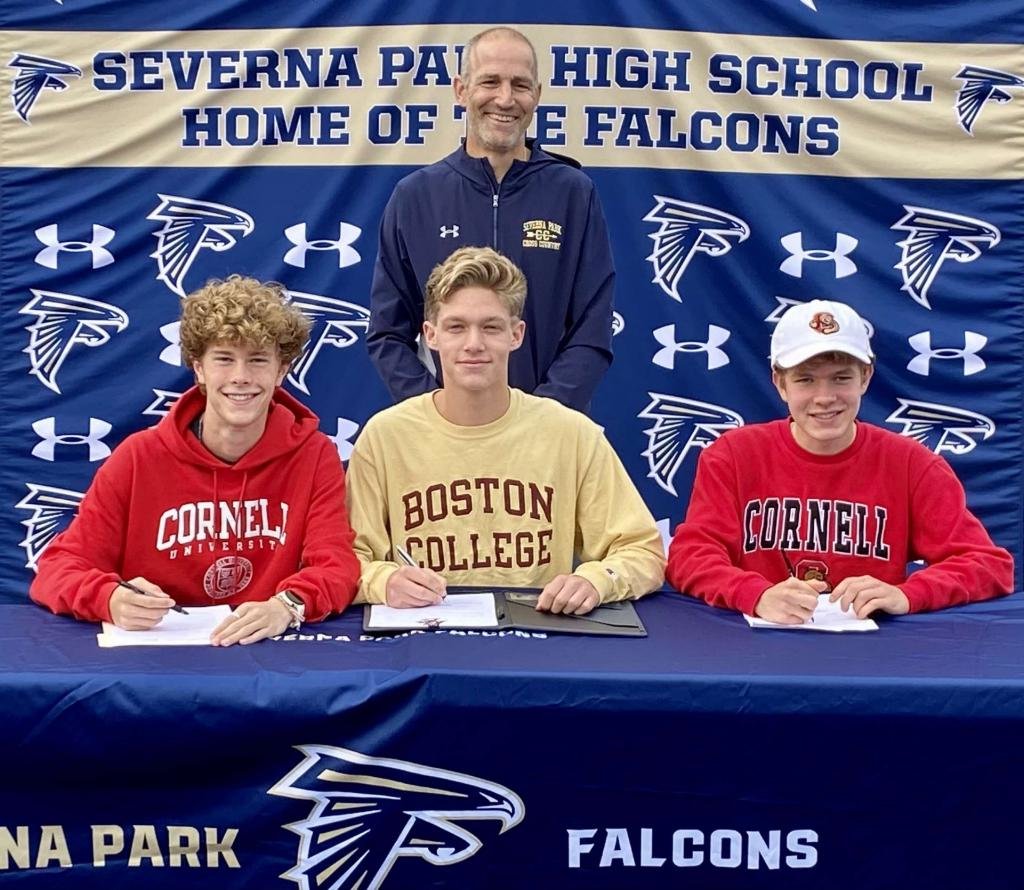 Tyler Canaday (left) and James Glebocki (right) were joined by coach Josh Alcombright and fellow track and field athlete Eddie Sullivan as they committed to Cornell.