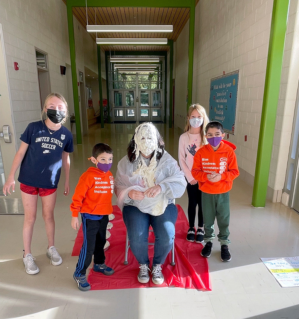Principal Sue Myers was pied in the face by Benfield’s top fundraisers, Hunter Flynn (fifth grade), Rocco Bianco (kindergarten), Reagan Townsend (third grade) and Luciano Bianco (third grade).