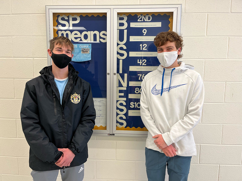 Josh Higgins (left) and Tyler Moran raised money, collected donations of video games and frozen dinners, and volunteered at the Port to Fort 6K sponsored by Believe In Tomorrow.