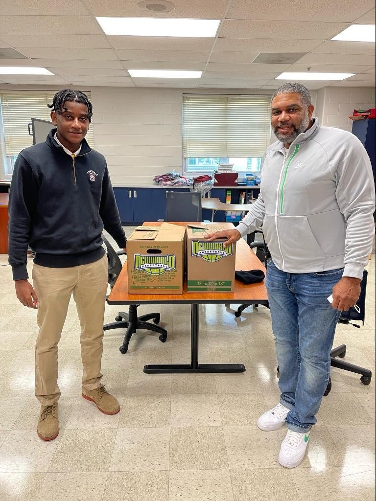 Jacob Randall’s middle school coach, Darryl Riddick, helped him identify families in need of Thanksgiving meals.