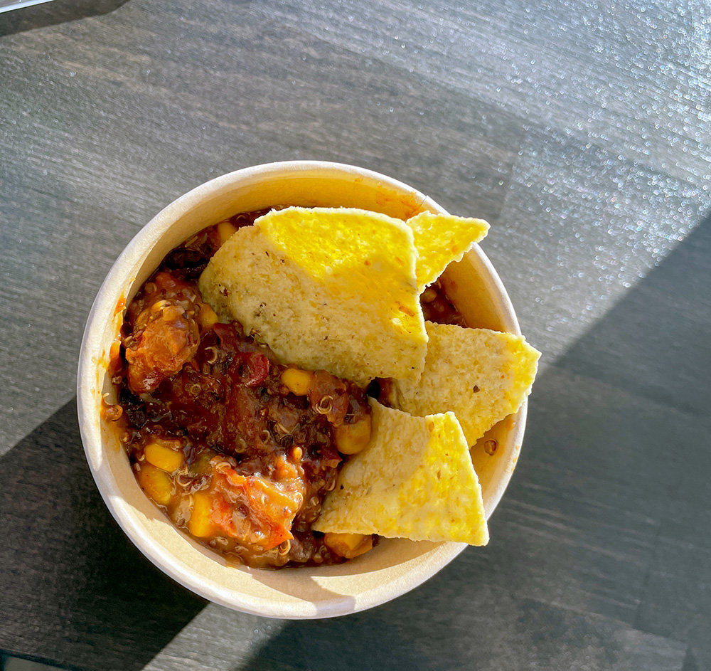 The vegan quinoa chili with corn, tomatoes and beans, served with tortilla chips, is a filling and savory comfort food.